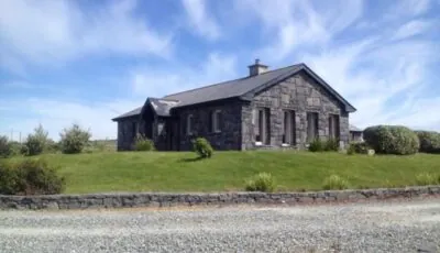 Detached cottage overlooking lake in Connemara